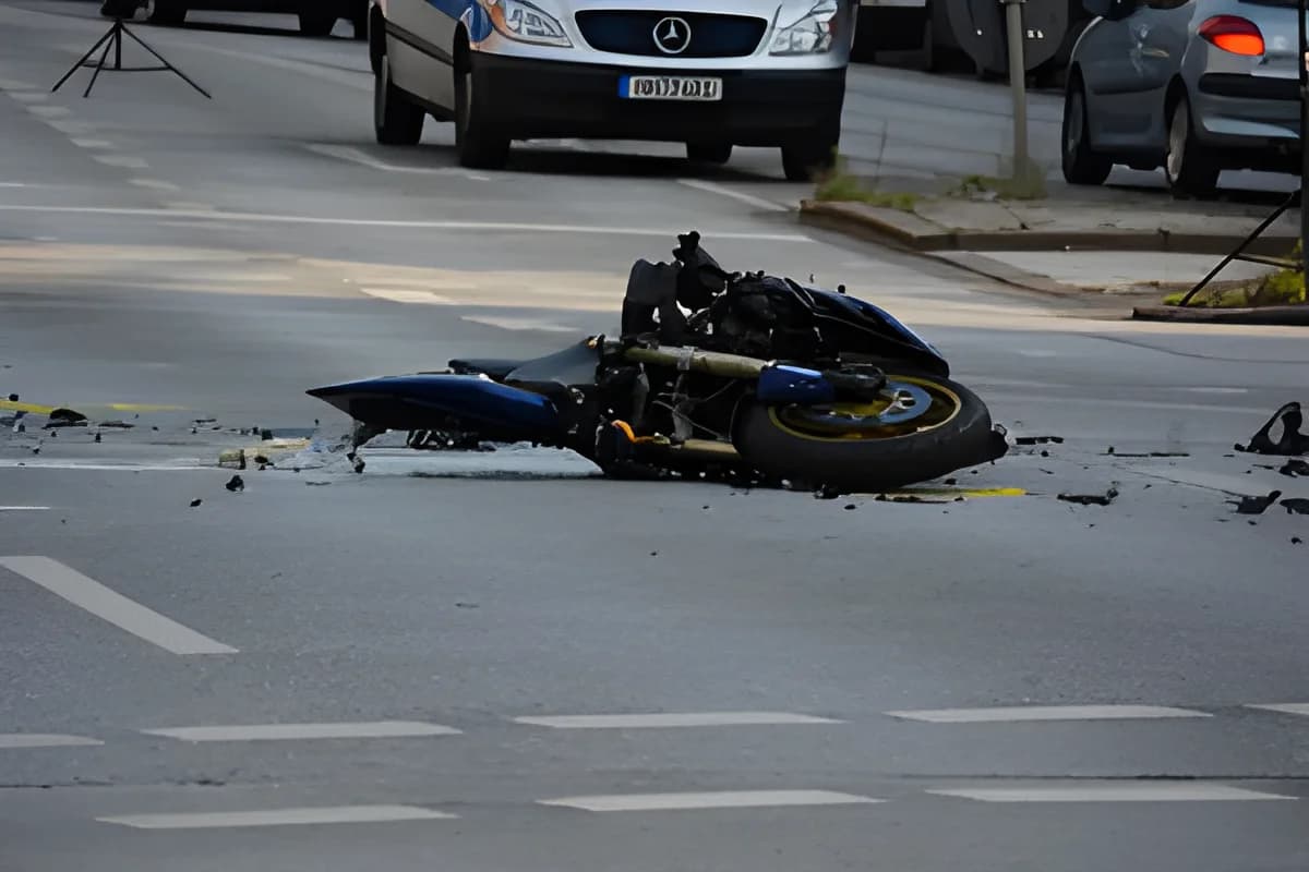 damaged motorcycle on road after accident