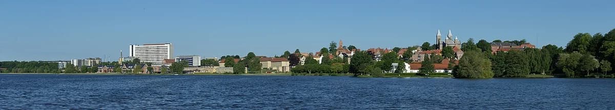 Viborg skyline across Søndersø in warm morning light.